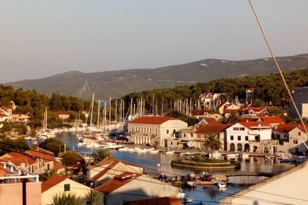 a town with boats docked in a harbor at Apartman Nađa in Vrboska