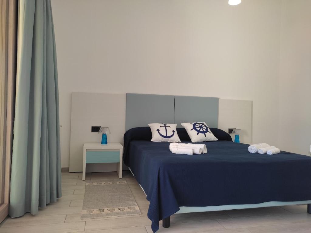 Postel nebo postele na pokoji v ubytování Hotel Pranos Turismo Rurale Cala Gonone