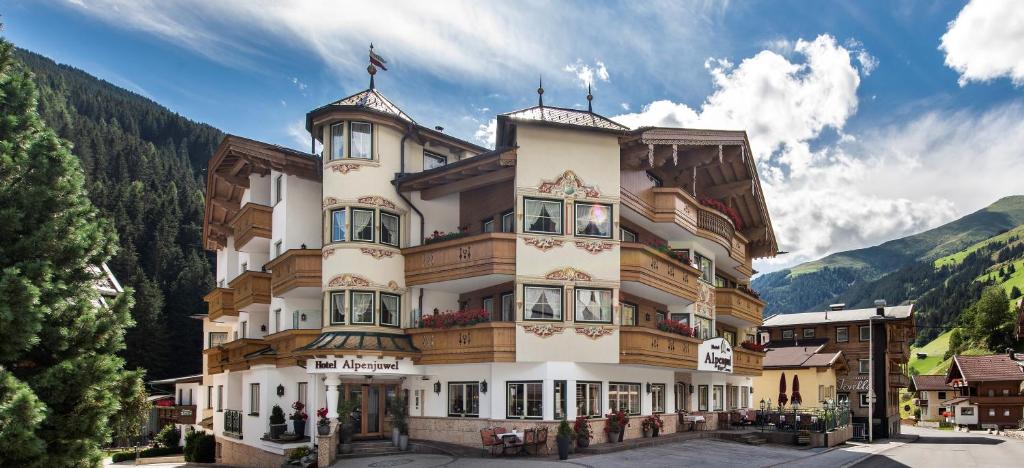 a large building in the middle of a mountain at Alpenjuwel Jäger in Tux