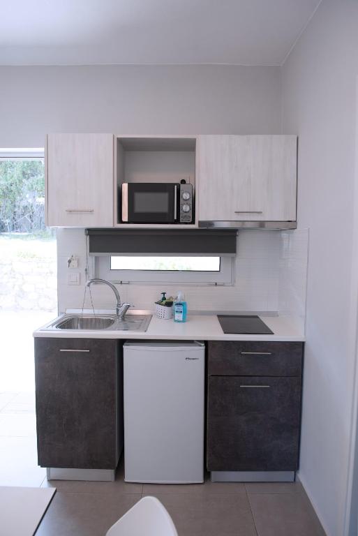 Kuchyň nebo kuchyňský kout v ubytování Gelli Apartments