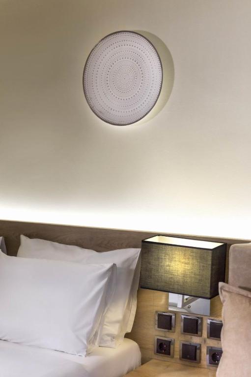 Postel nebo postele na pokoji v ubytování Hotel Odysseas