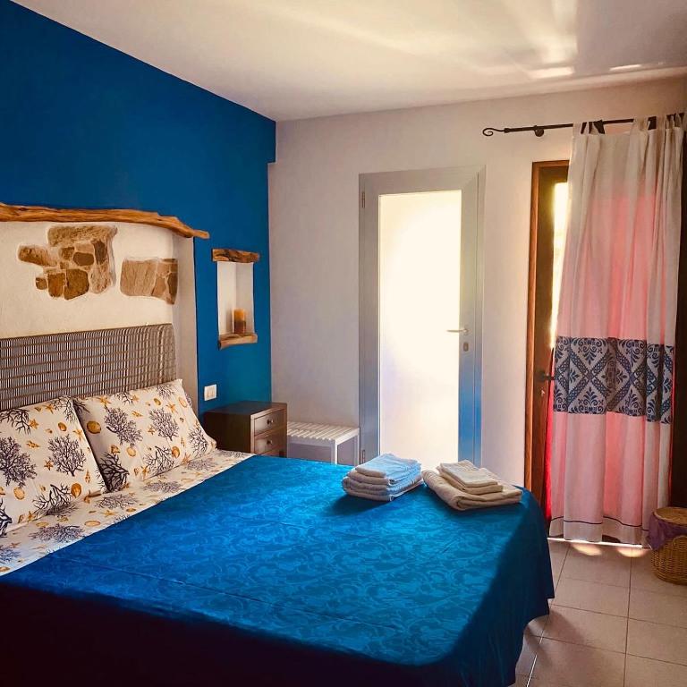 Postel nebo postele na pokoji v ubytování B&B Su Tostainu