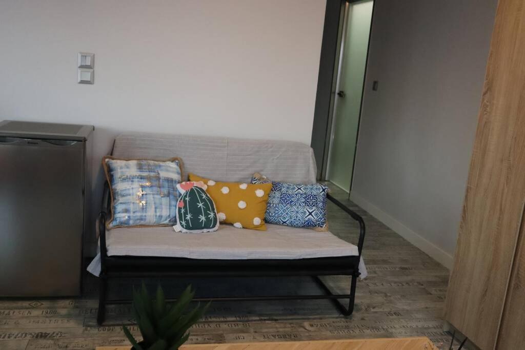 A seating area at 360° View Suites Cos