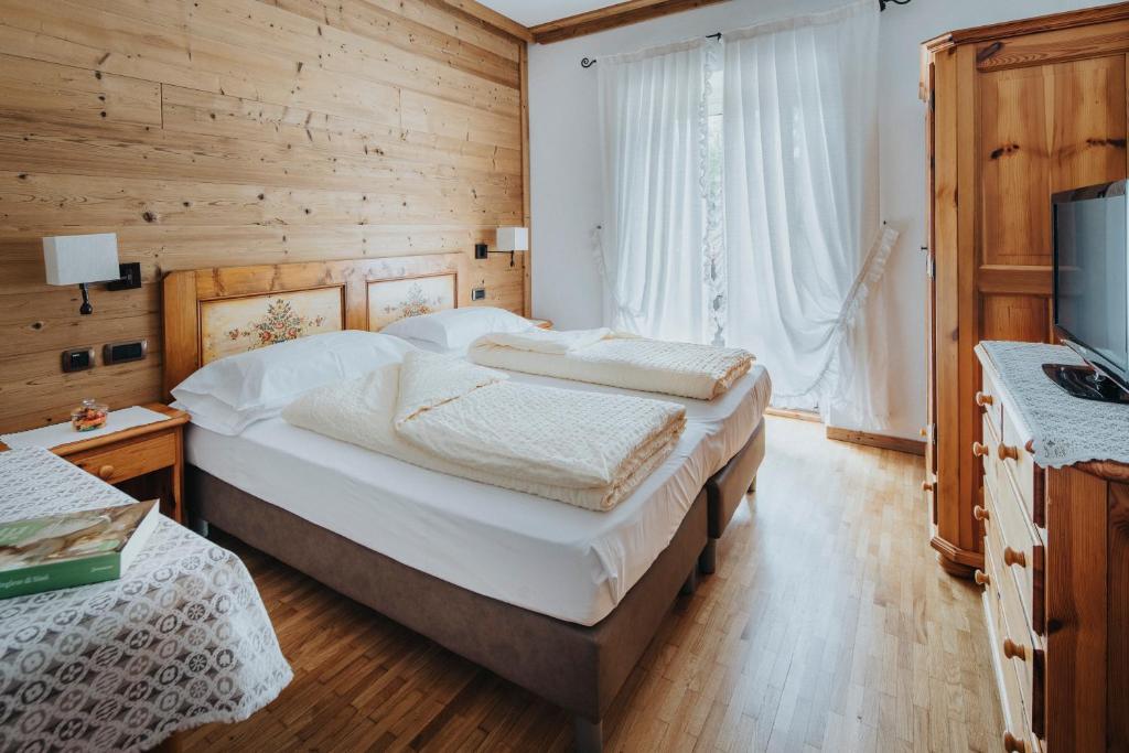 Кровать или кровати в номере Hotel Menardi