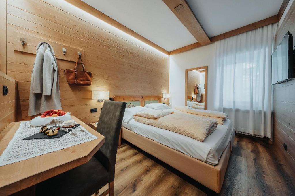 Кровать или кровати в номере Hotel Menardi