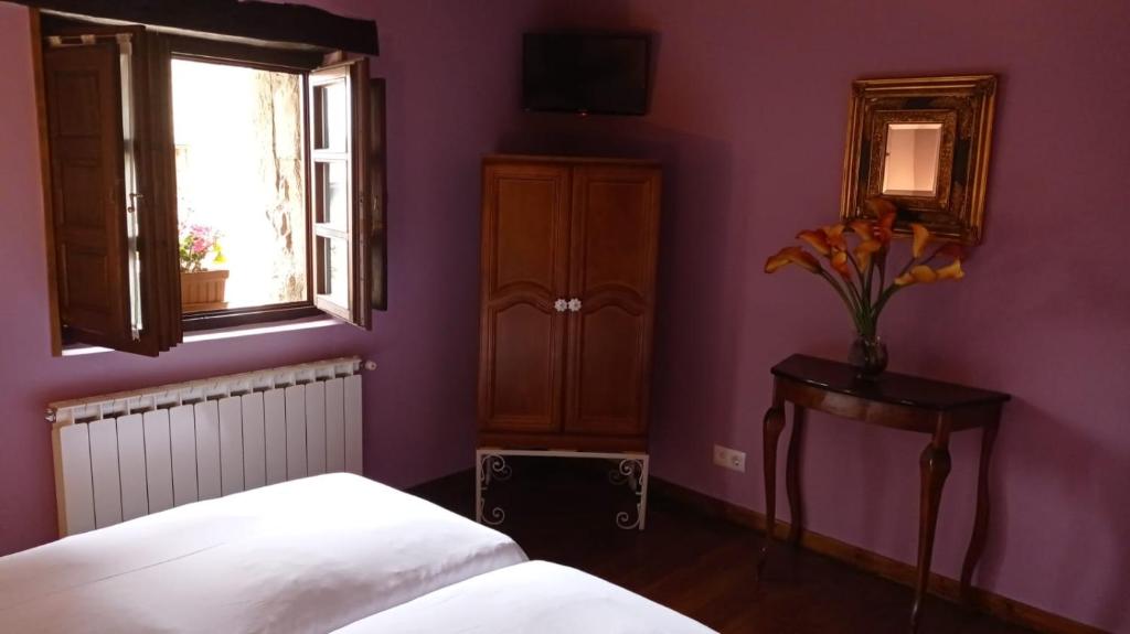 A bed or beds in a room at Posada Reserva Verde