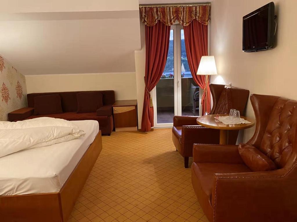 Postel nebo postele na pokoji v ubytování Hotel Kaiser Franz Josef