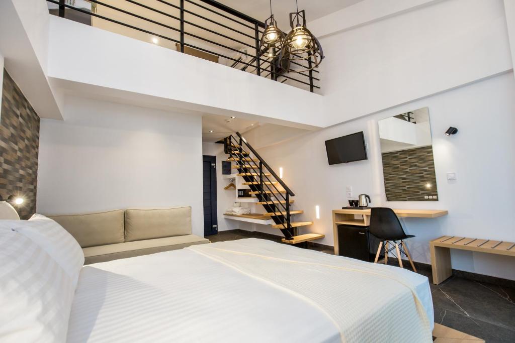 Postel nebo postele na pokoji v ubytování Epicentrum Suites