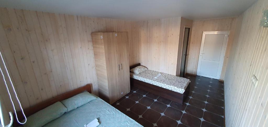 Postel nebo postele na pokoji v ubytování Santorini Beach Hotel Koblevo