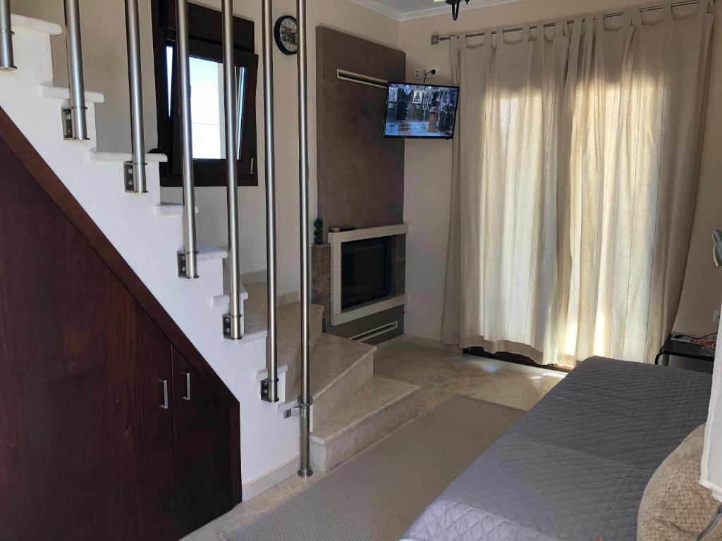 Televízia a/alebo spoločenská miestnosť v ubytovaní AM Beach House