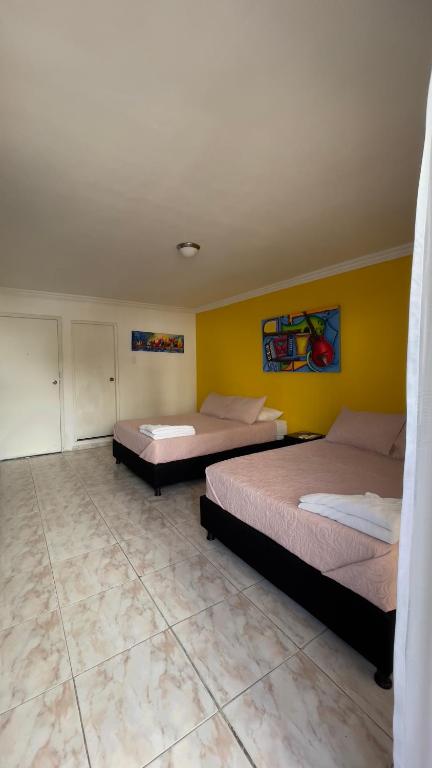Postel nebo postele na pokoji v ubytování Hotel Balcones de Bocagrande