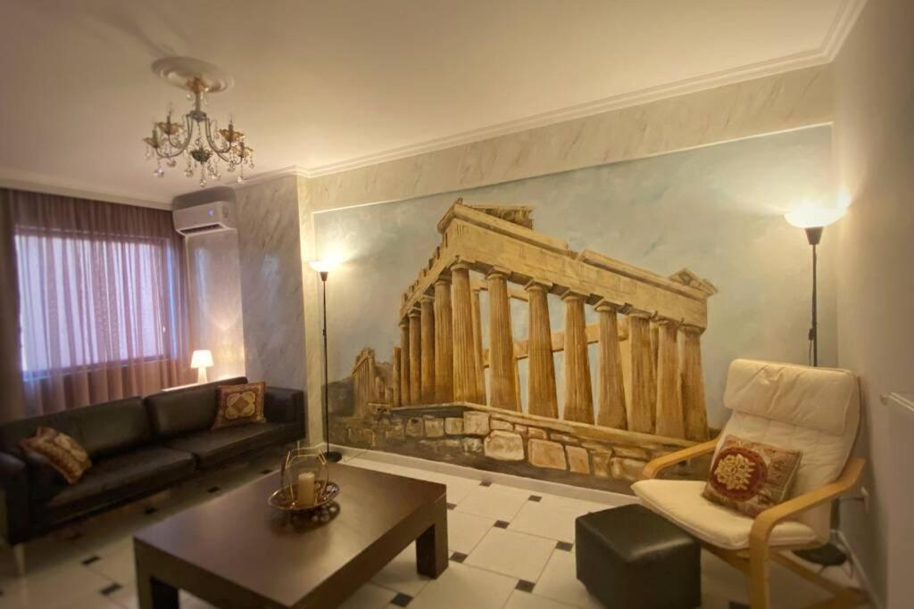 a living room with a painting on the wall at MyAcropolis in Athens