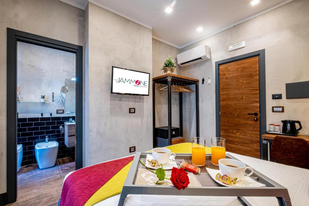 TV a/nebo společenská místnost v ubytování casajammone naples b&b