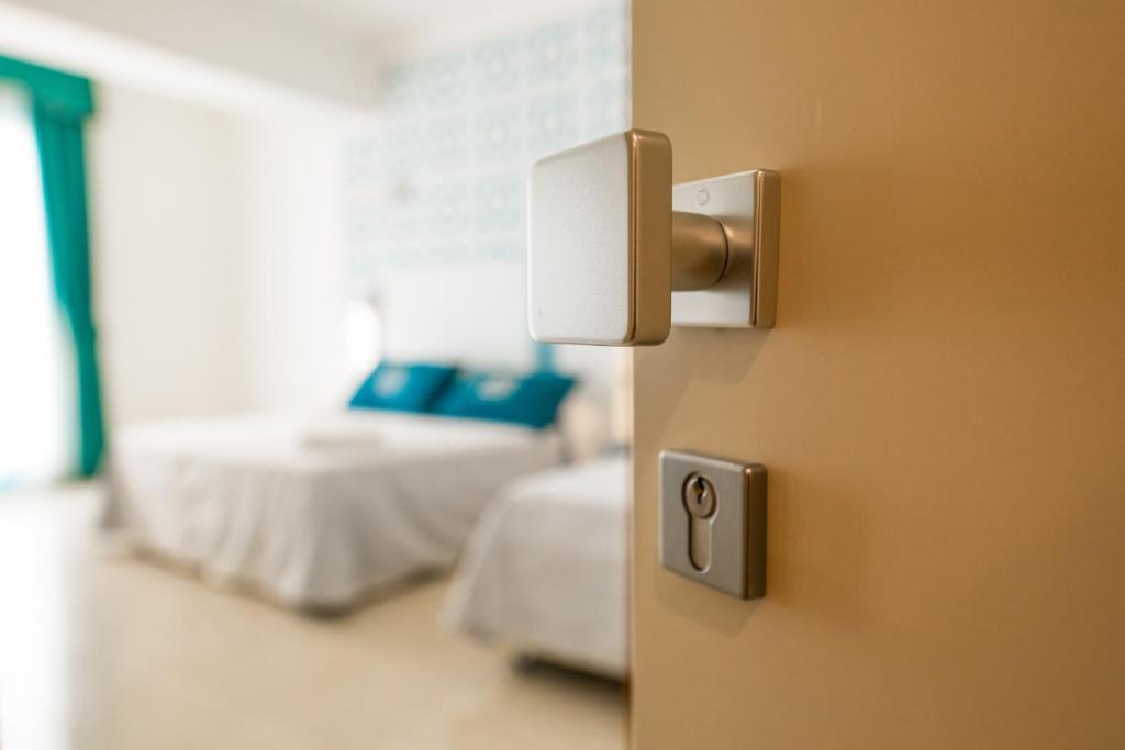 Postel nebo postele na pokoji v ubytování Hotel Magna Grecia