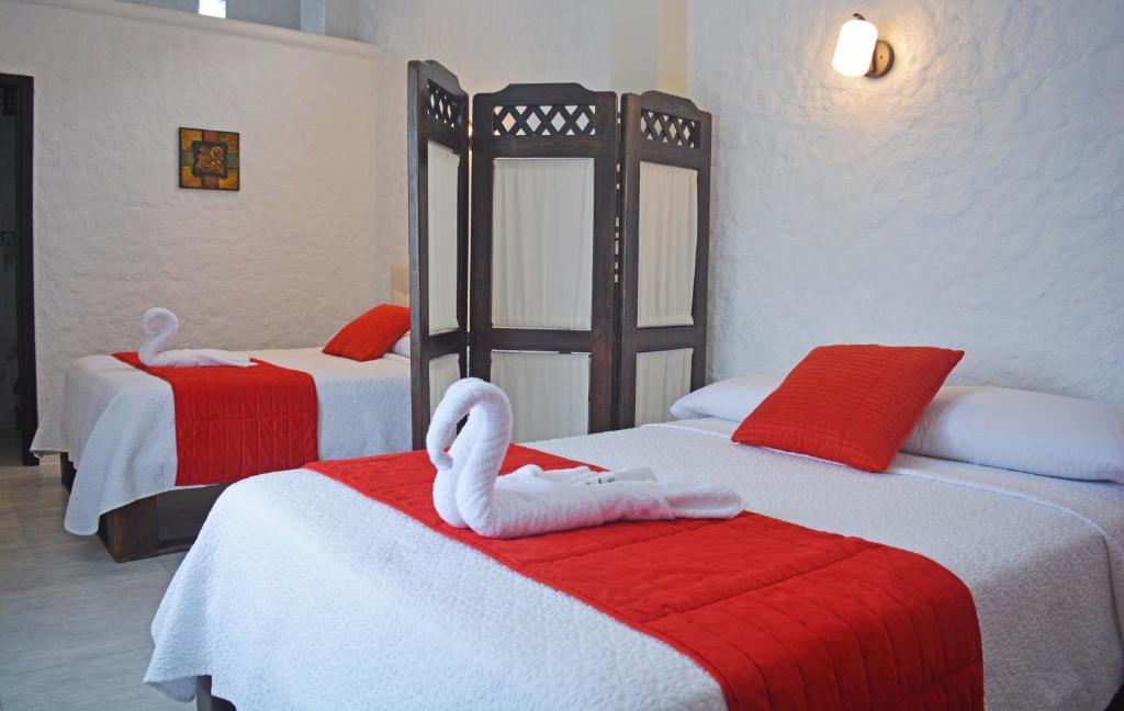 Postel nebo postele na pokoji v ubytování Hostal Cann's House