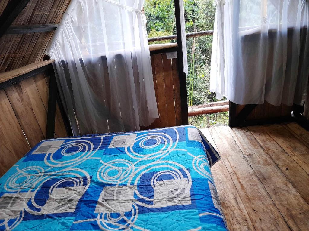 Postel nebo postele na pokoji v ubytování Posada Fin del Mundo