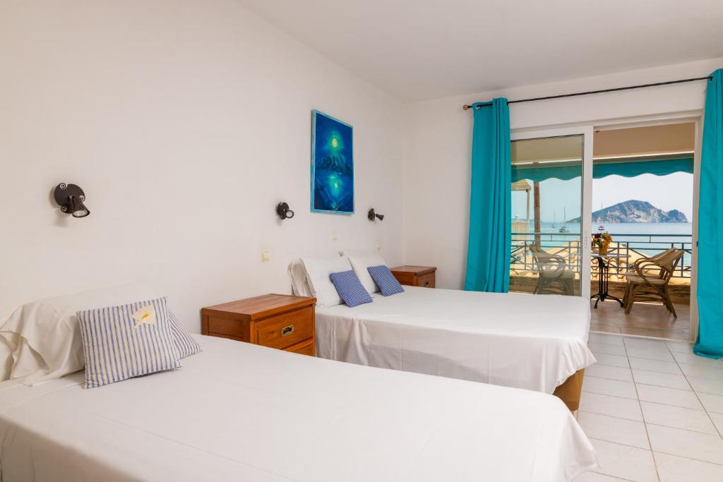 Postel nebo postele na pokoji v ubytování SeaSide Apartments