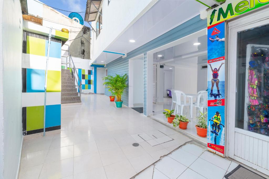 a hallway of a building with a lego store at La isla inn in San Andrés