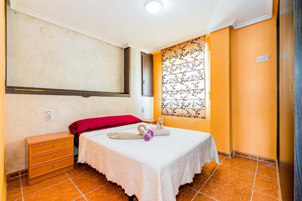 Кровать или кровати в номере Apartamento sunrise Correos