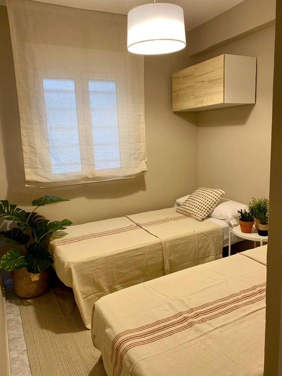 Postel nebo postele na pokoji v ubytování Homing La Pineda 23
