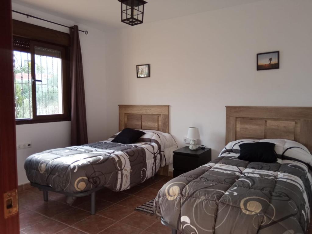 Postel nebo postele na pokoji v ubytování Alojamiento Rural MAGALAN