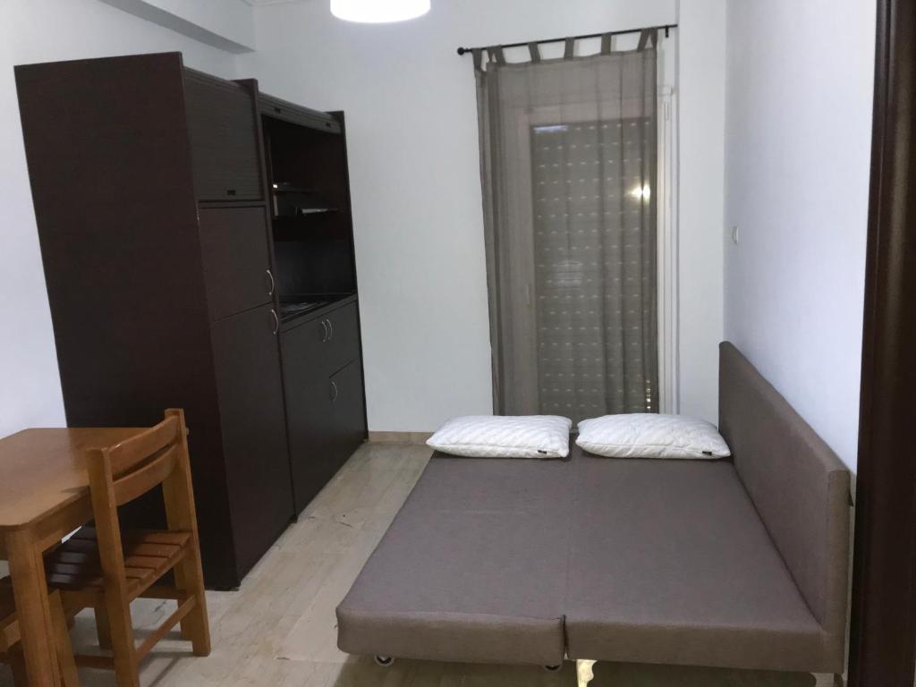 Posteľ alebo postele v izbe v ubytovaní Metamorfosis Apartments