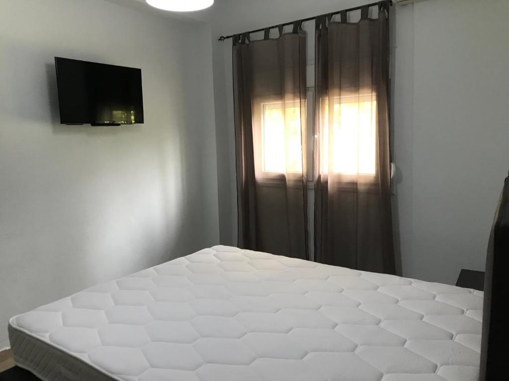 Posteľ alebo postele v izbe v ubytovaní Metamorfosis Apartments