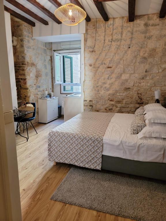 Postel nebo postele na pokoji v ubytování Palace Wall Residences
