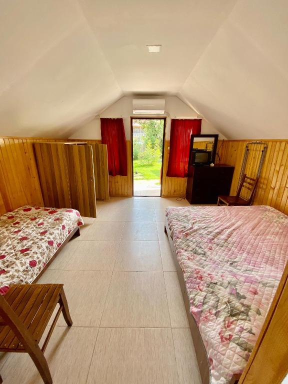 Postel nebo postele na pokoji v ubytování Cabins in Magnetiti, Ureki