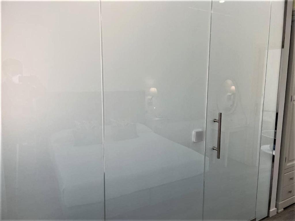 Кровать или кровати в номере Hotel Malaga Picasso