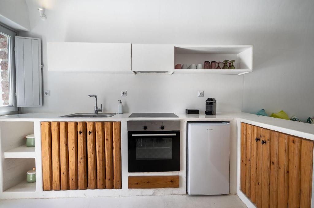 Kuchyň nebo kuchyňský kout v ubytování Fertimo Suites