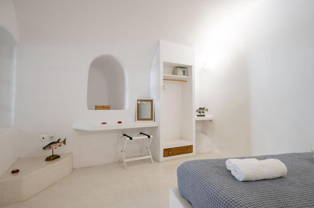 Postel nebo postele na pokoji v ubytování Fertimo Suites