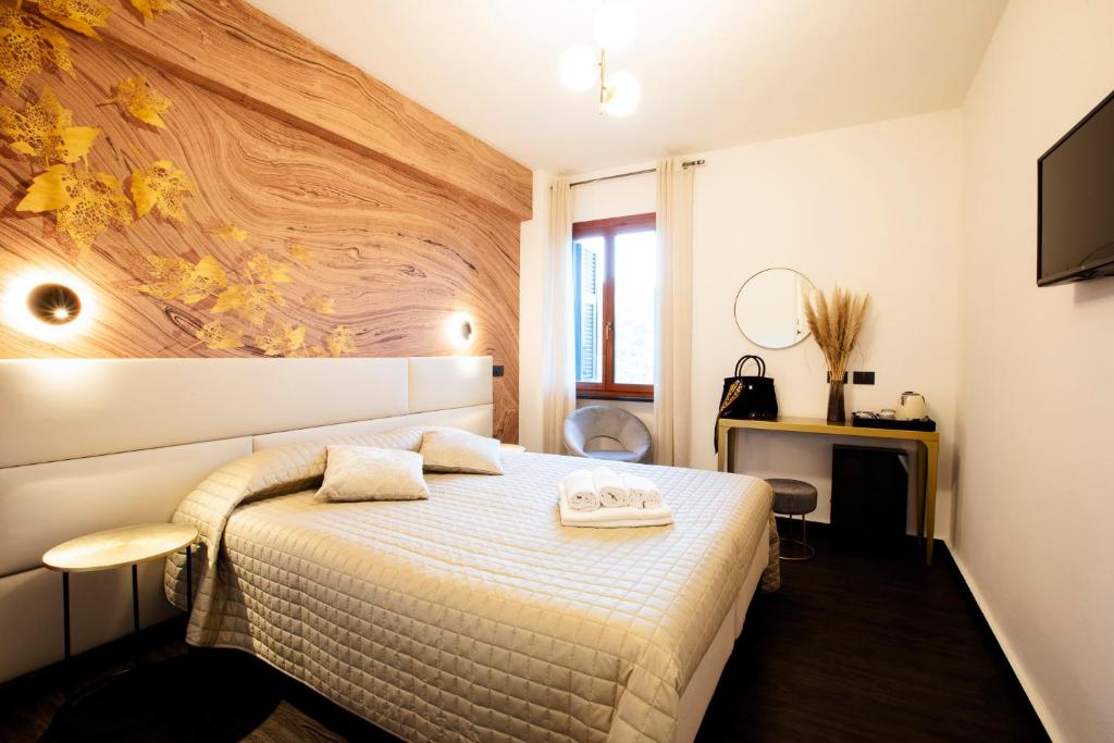 Televízia a/alebo spoločenská miestnosť v ubytovaní Bellevue - Rooms & Suites
