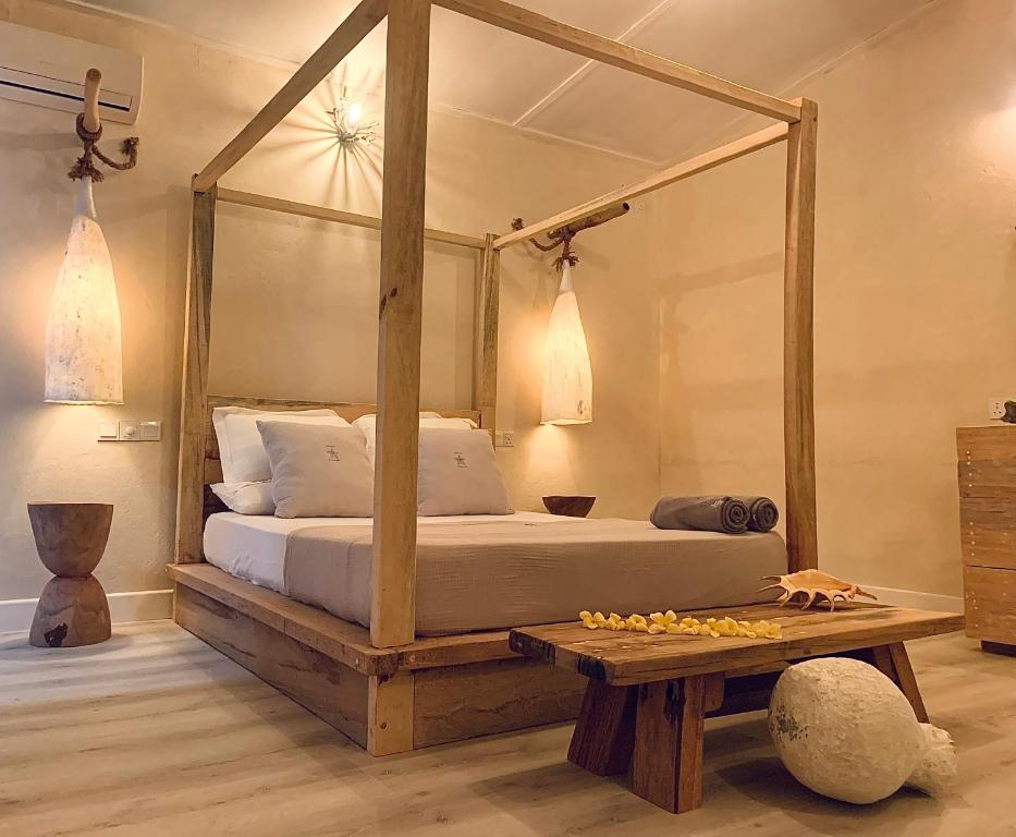 Ліжко або ліжка в номері Thari Fushi Luxury Maldivian Experience - All Inclusive
