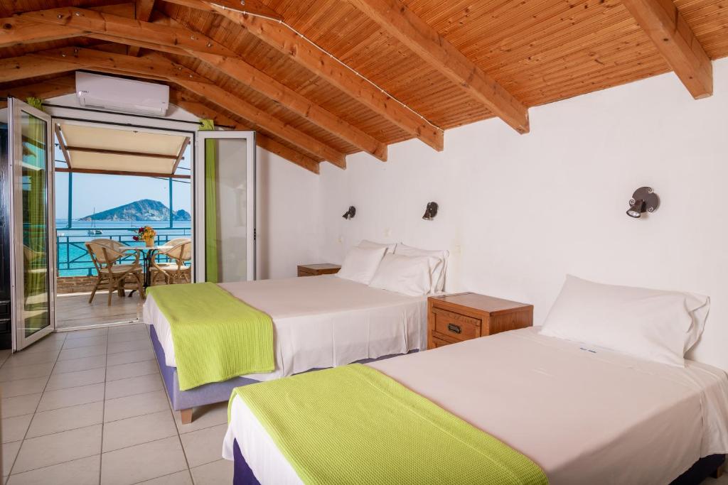 Postel nebo postele na pokoji v ubytování SeaSide Apartments