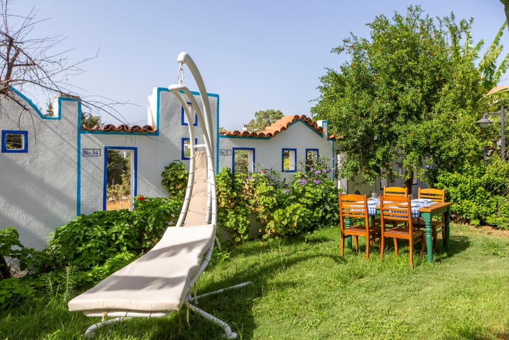 A garden outside La Brezza Suite & Hotel