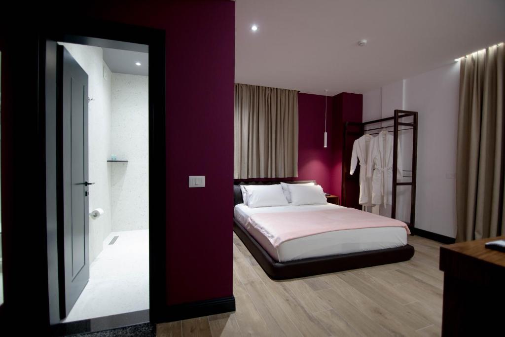 Postel nebo postele na pokoji v ubytování Mergan Hotel