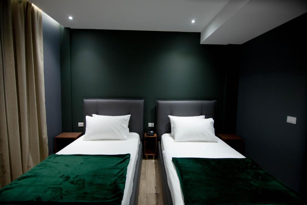 Postel nebo postele na pokoji v ubytování Mergan Hotel