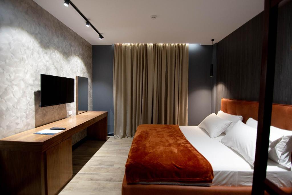 Postel nebo postele na pokoji v ubytování Mergan Hotel