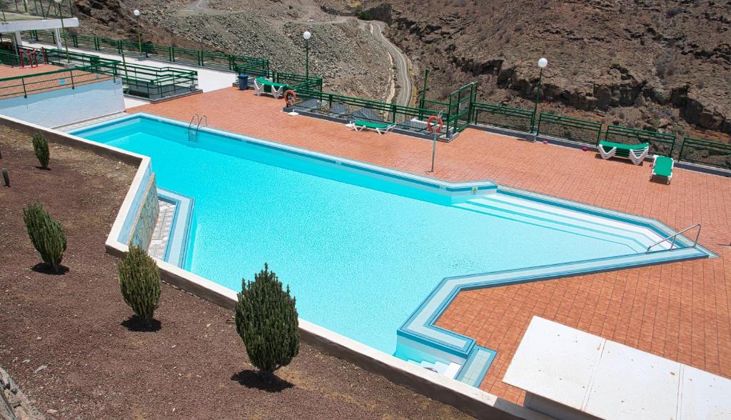 Basen w obiekcie Malibu apartamento con campo de tennis y piscina con solarium lub w pobliżu