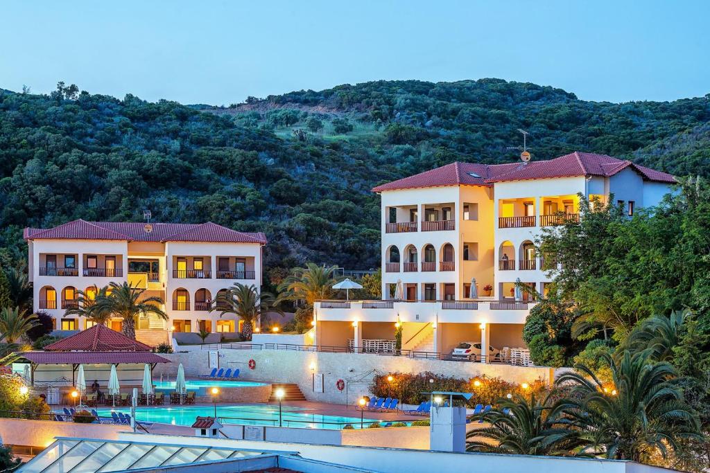 a view of a resort with a swimming pool at Xenios Theoxenia Hotel in Ouranoupoli