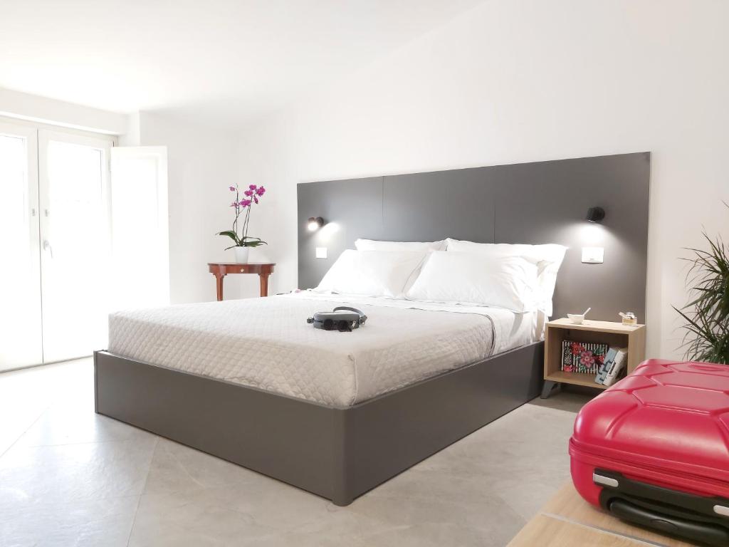 Een bed of bedden in een kamer bij Principe Rooms
