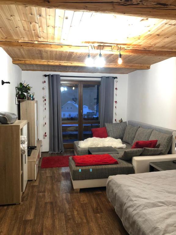 Postel nebo postele na pokoji v ubytování Apartmán s výhledem na Jezerní stěnu