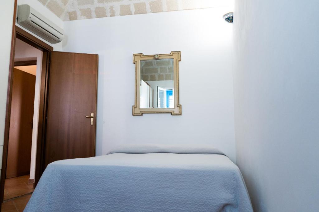 Postel nebo postele na pokoji v ubytování Appartamenti Praya