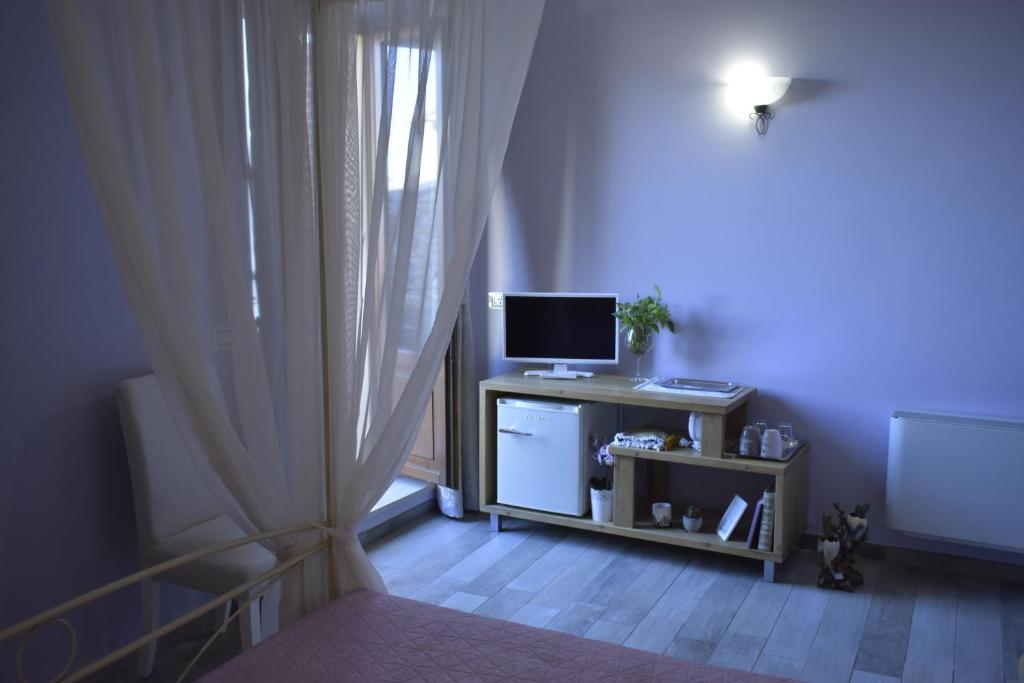 TV a/nebo společenská místnost v ubytování Piazzetta Del Buonumore