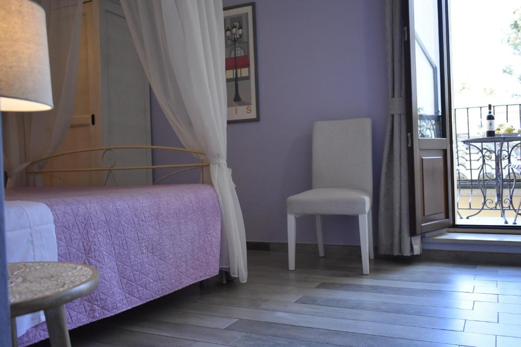 Postel nebo postele na pokoji v ubytování Piazzetta Del Buonumore