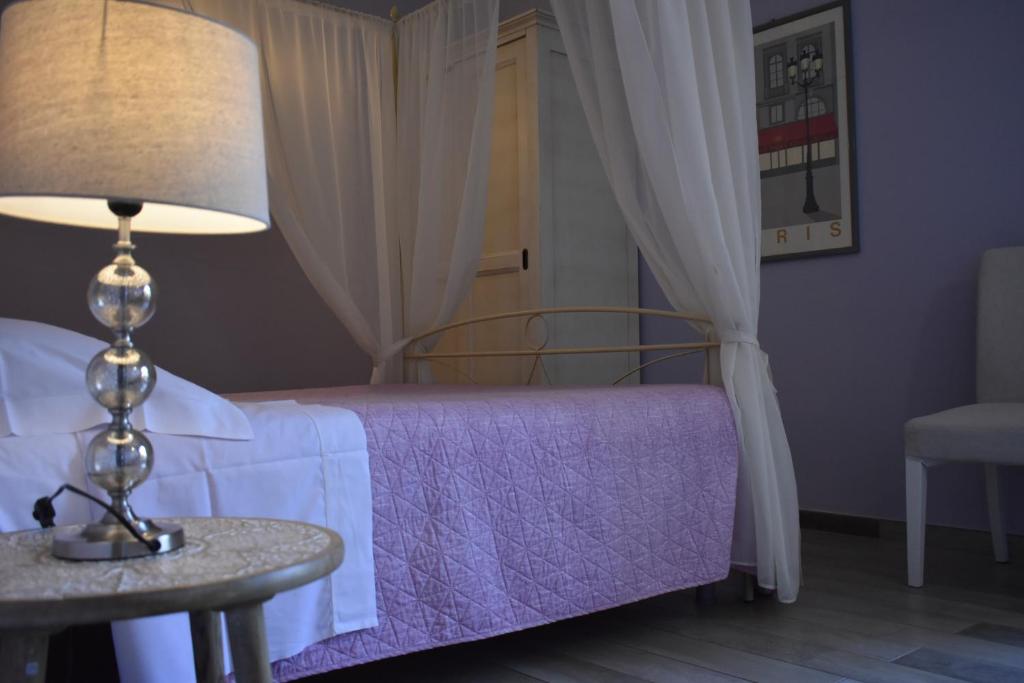Postel nebo postele na pokoji v ubytování Piazzetta Del Buonumore