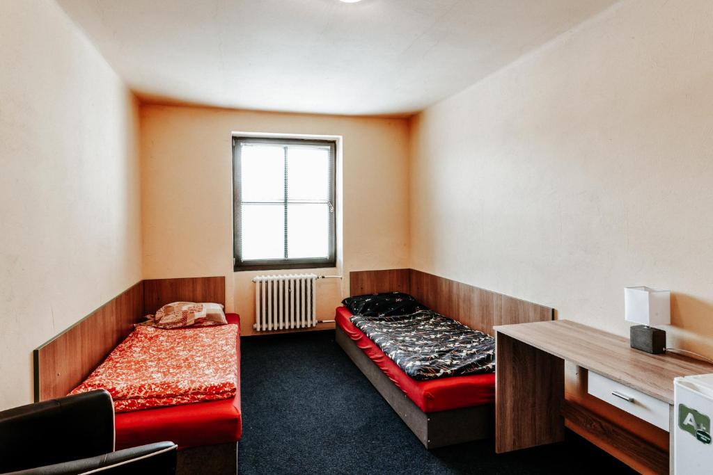 Rúm í herbergi á Na Knížecí Husinec