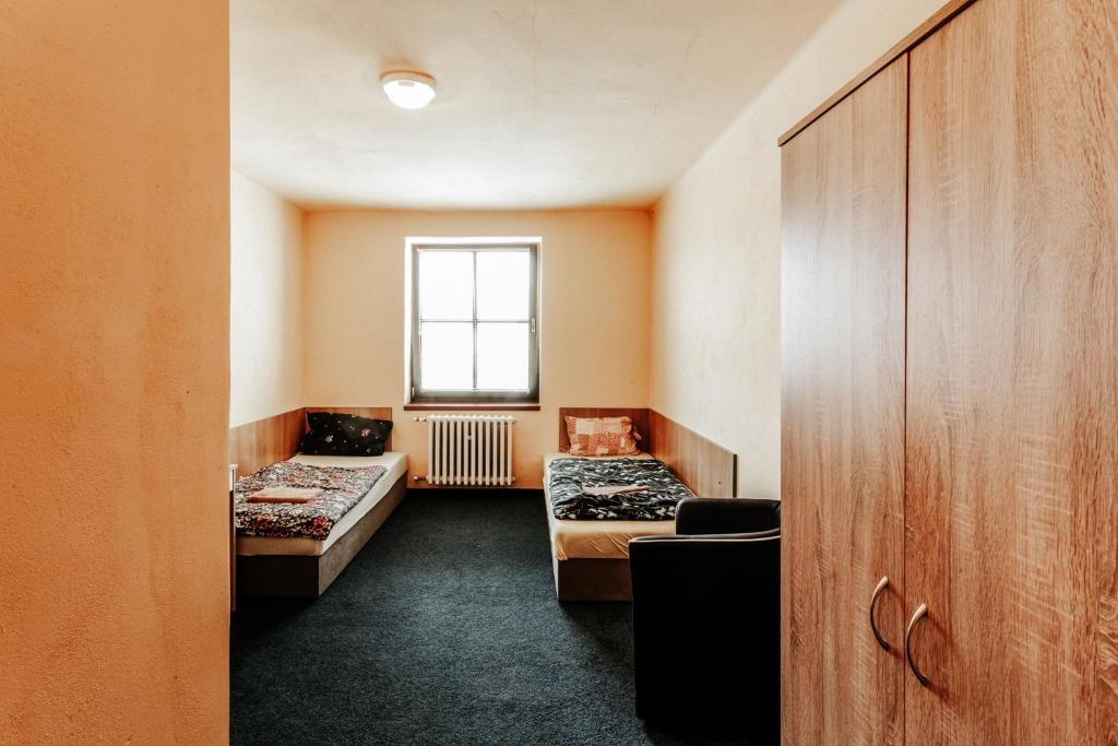 Rúm í herbergi á Na Knížecí Husinec