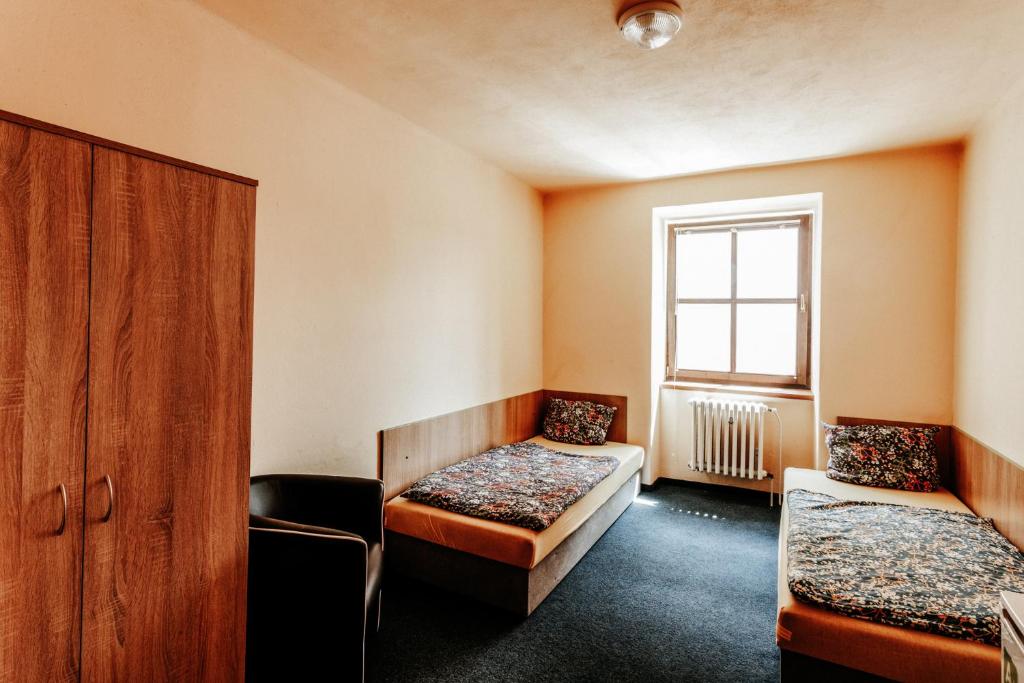 Rúm í herbergi á Na Knížecí Husinec